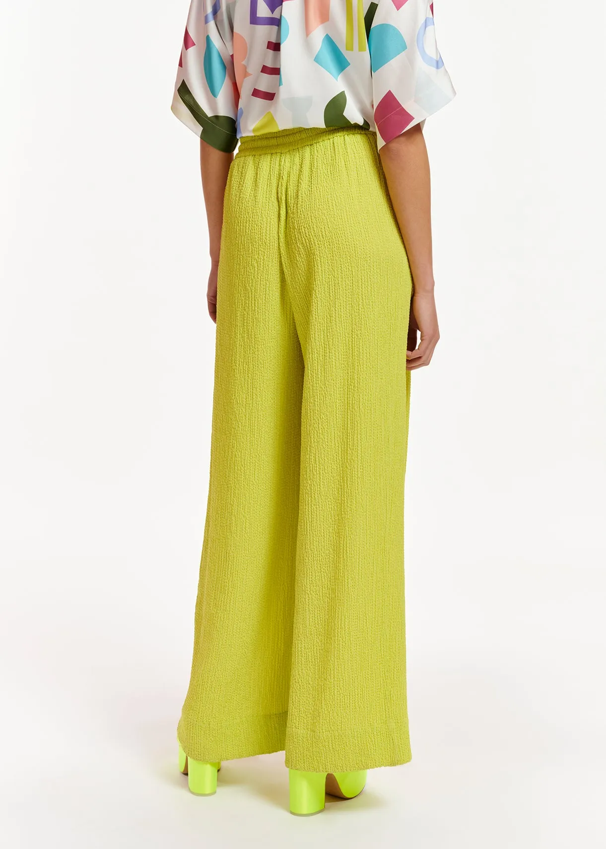 Lime green wide-leg seersucker pants