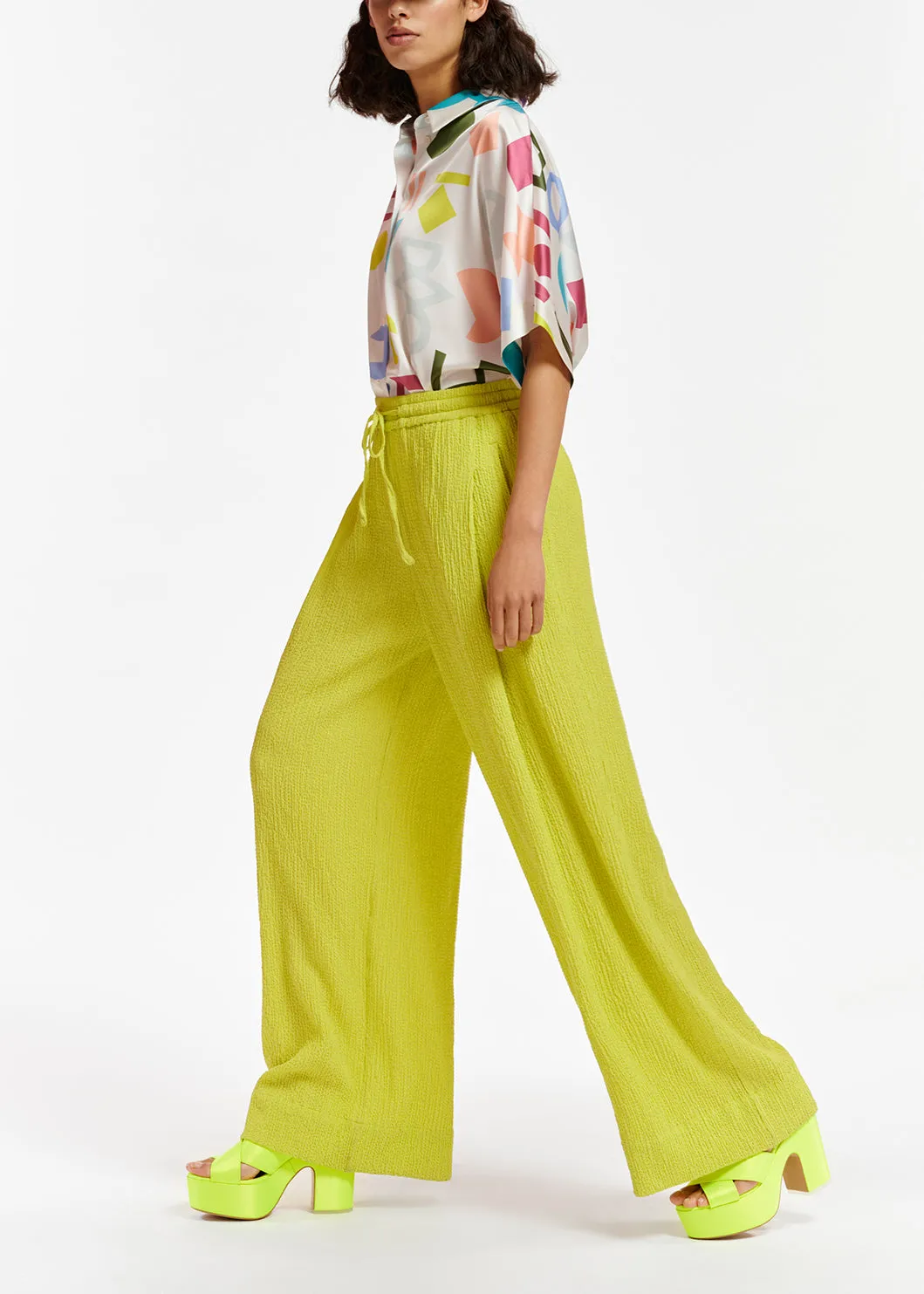 Lime green wide-leg seersucker pants